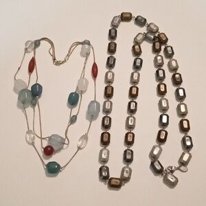 #1112.  2 Piece Assorted Blue And Silver Toned Acrylic Necklace Bundle.